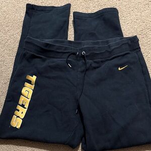 Nike women’s Black sweats with straight leg with Gold Accents